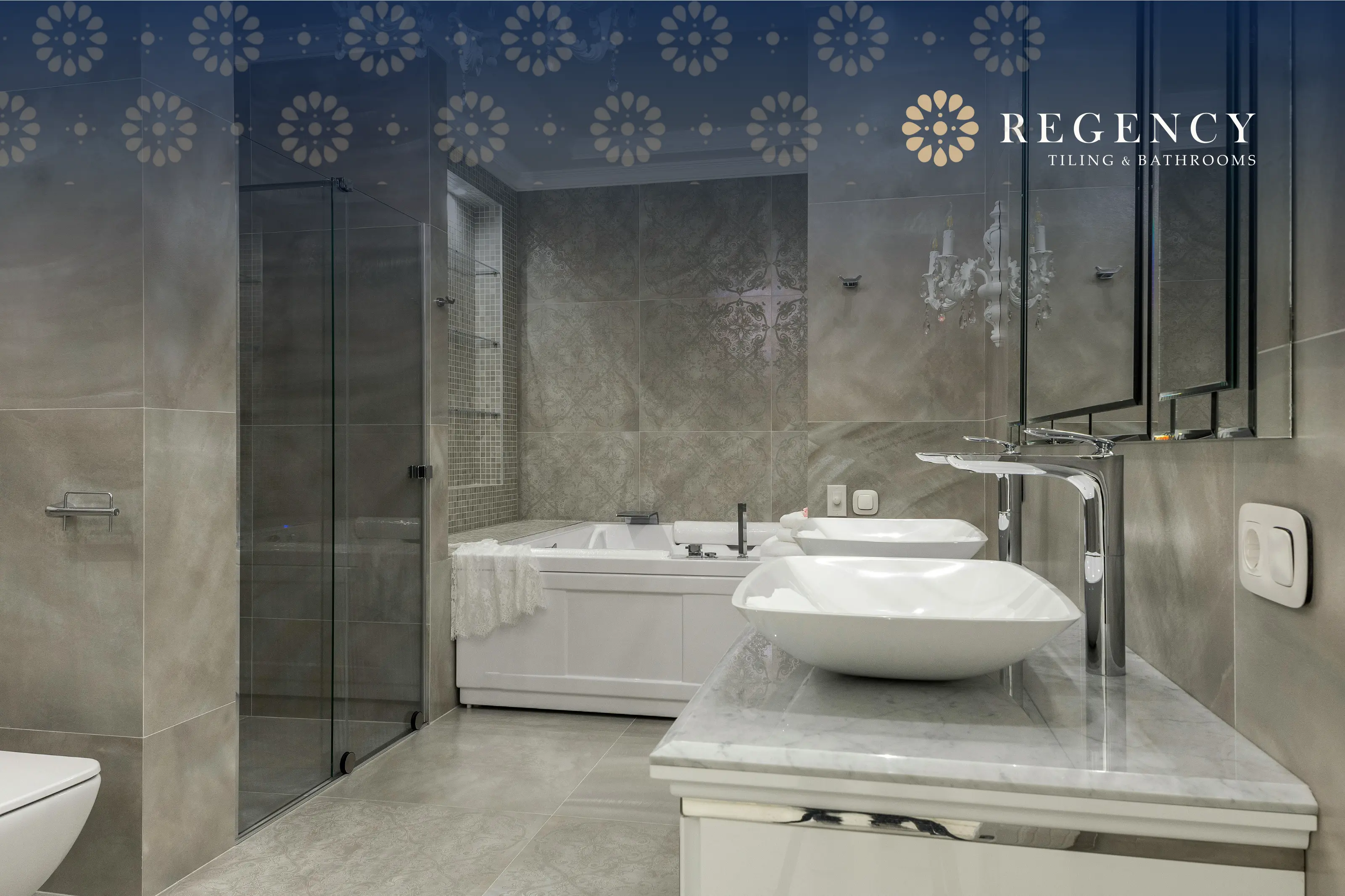Sleek grey-tiled bathroom with modern basin units and walk-in shower, fitted with enduring care and precision.